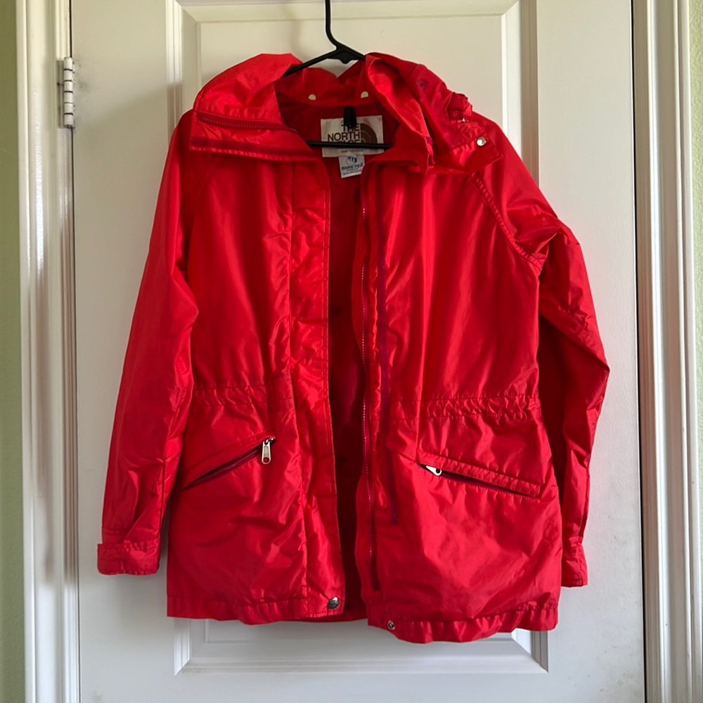 The North Face red orange windbreaker jacket